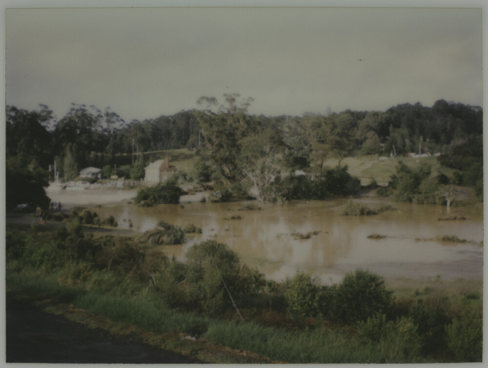 Looking across flooded river to Stone Store