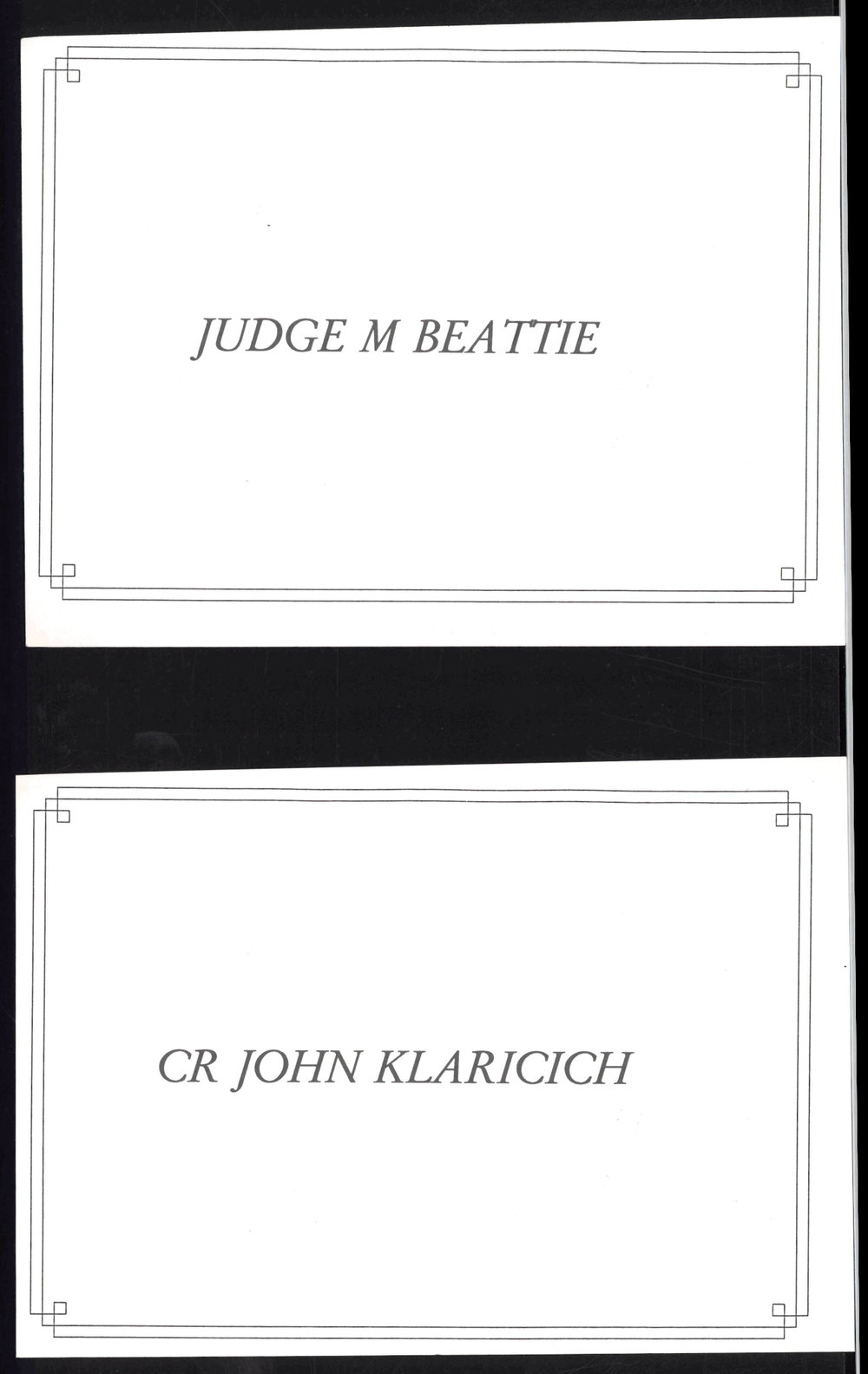 Place cards for Judge M Beattie and CR John Klaricich