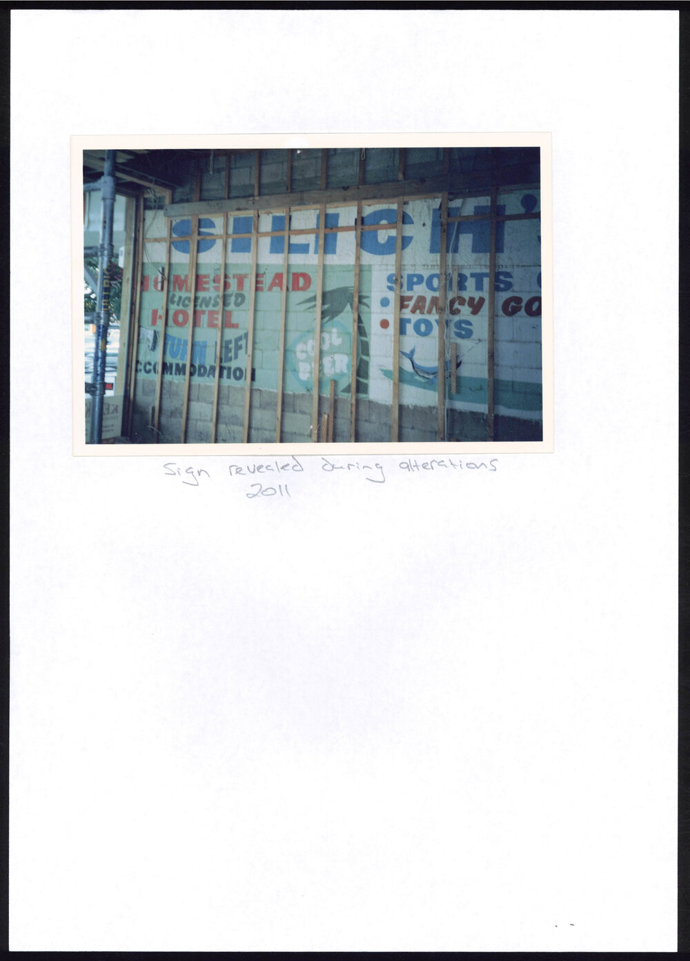 Photograph of a sign revealed during alterations