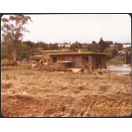 Debris up against house at Waipapa Landing