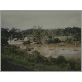 Looking across flooded river to Stone Store